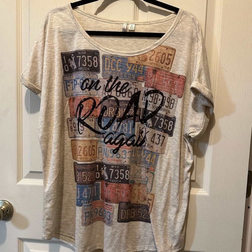 Ladies graphic tee shirt. Cream colored tee size Large.